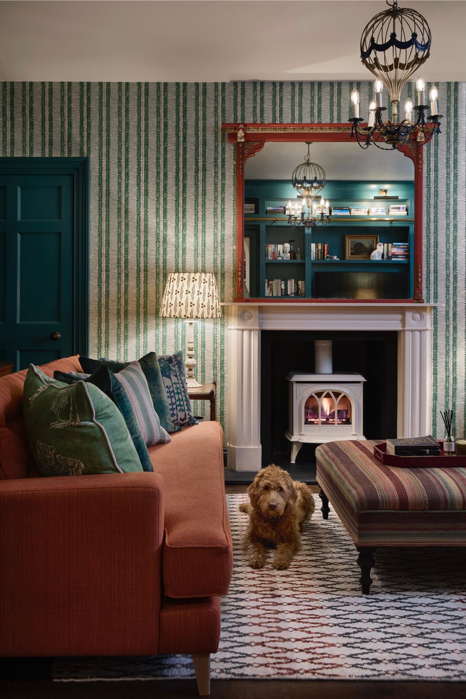 Image may contain: Home Decor, Indoors, Interior Design, Couch, Furniture, Animal, Canine, Dog, Mammal, Pet, and Architecture