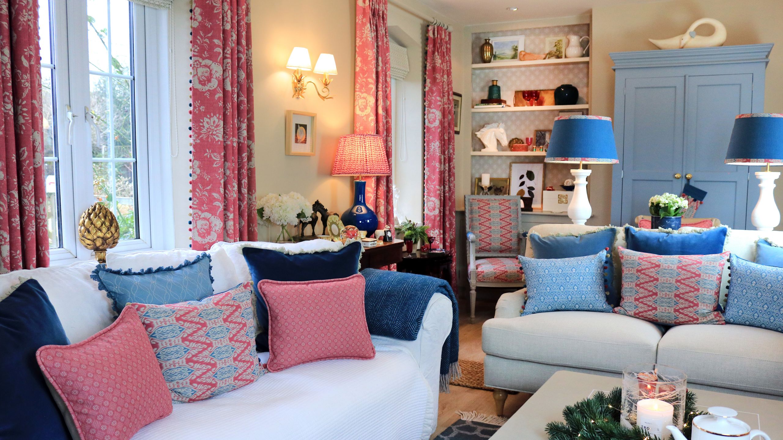 Image may contain: Cushion, Home Decor, Pillow, Chair, Furniture, Couch, Candle, Lamp, Art, Painting, and Architecture