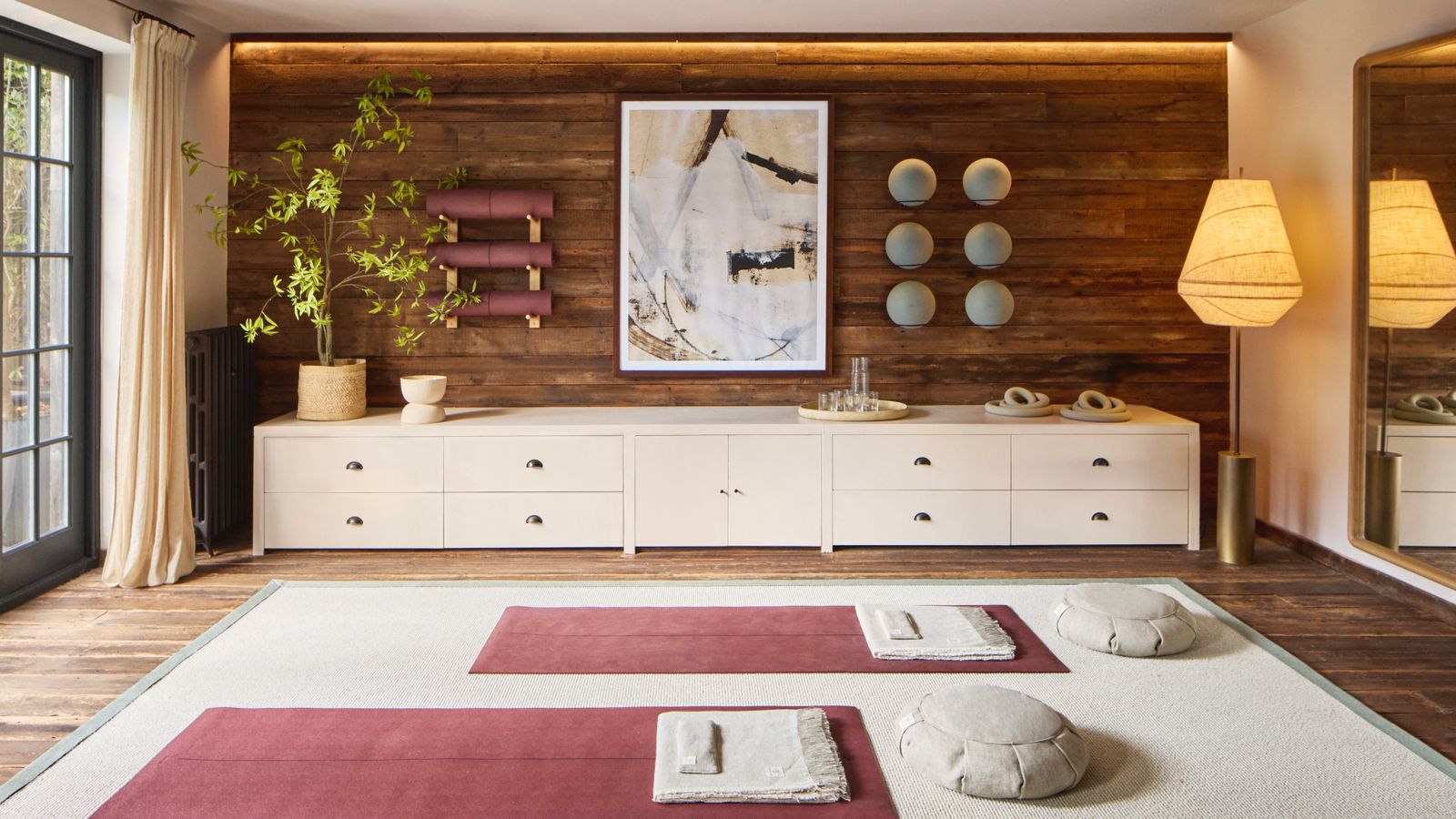 Image may contain Indoors Interior Design Home Decor Rug Furniture Sideboard Wood Panels Art and Painting